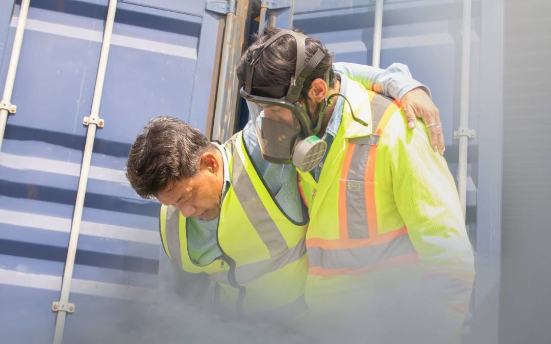 Worker assisting a colleague affected by gas exposure, emphasizing the importance of LDAR regulations for safety.