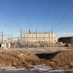 Energy facility with transmission lines, reflecting infrastructure subject to AER Directive 017 emissions compliance.