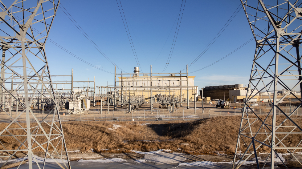 Energy facility with transmission lines, reflecting infrastructure subject to AER Directive 017 emissions compliance.