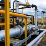 Gas facility pipelines and valves demonstrating methane emissions reduction through advanced systems and design