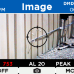 Infrared gas detection camera screen showing gas leak measurement data with target area, PPM readings, alarm level, and timestamp.